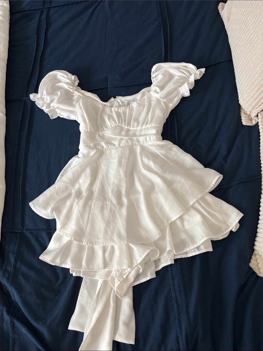 Francesca’s white romper with tie in the back